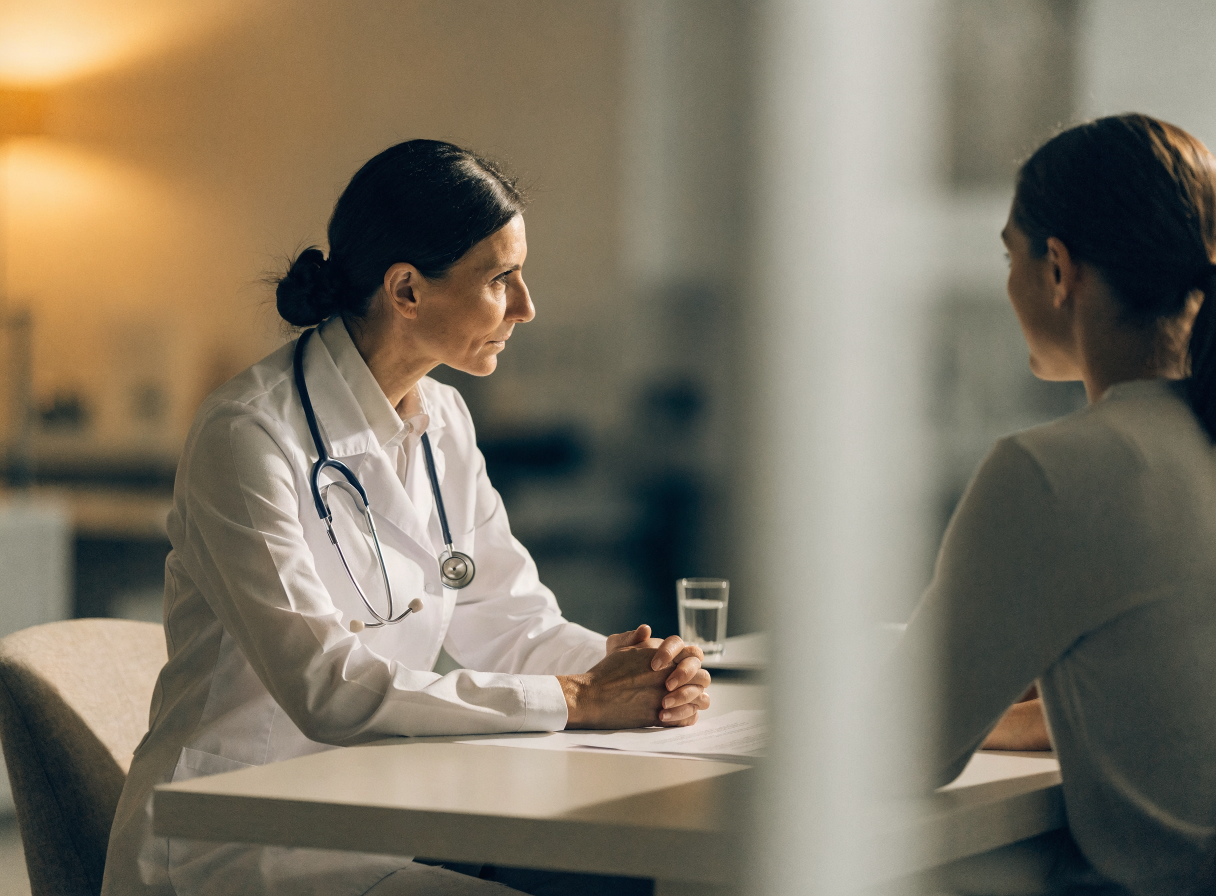 Physician consulting with a patient